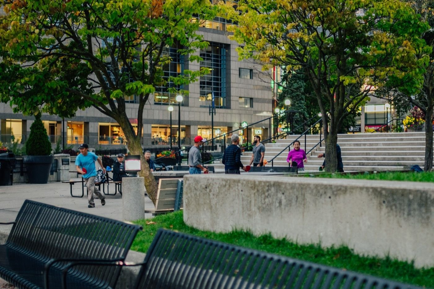 People in a public square near Yonge & Sheppard in North York on an autumn evening